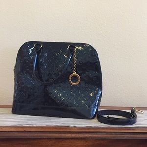 Invece patent leather handbag.